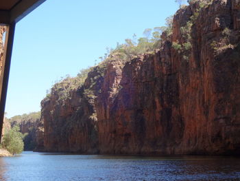 Low angle view of rock formations on coast