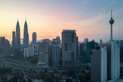 High angle view of city lit up at night