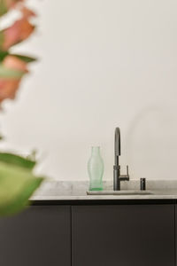 Close-up of bottles on table at home