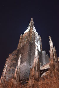 Low angle view of illuminated temple against clear sky at night