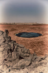 Scenic view of land against sky