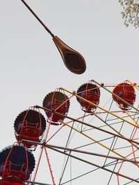 Low angle view of ferris wheel against sky