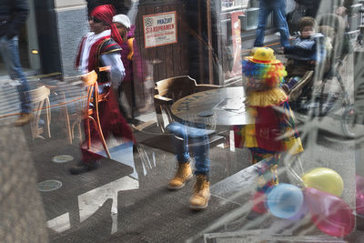 People walking on street in city