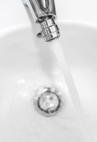 Close-up of faucet in bathroom