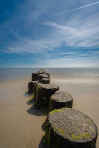 Lifeguard hut on beach against sky