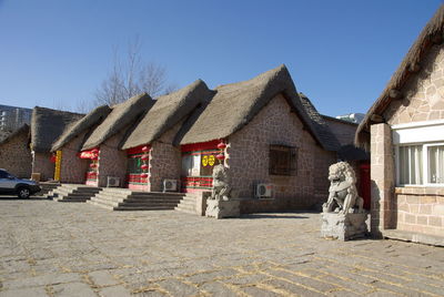 Statue of historic building against clear blue sky