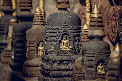 Statue of buddha against building