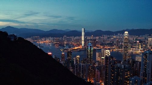 Aerial view of city lit up at night