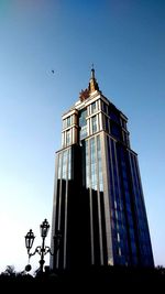 Low angle view of building against clear blue sky