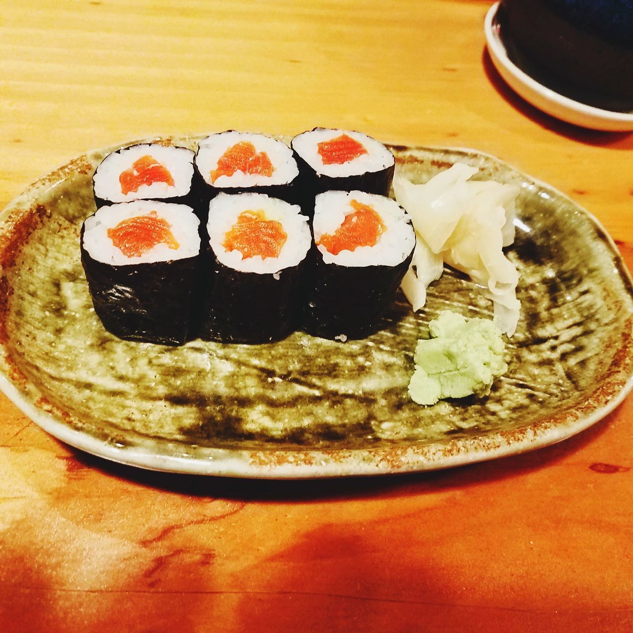 CLOSE-UP OF SUSHI SERVED ON TABLE