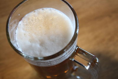 High angle view of beer in glass on table