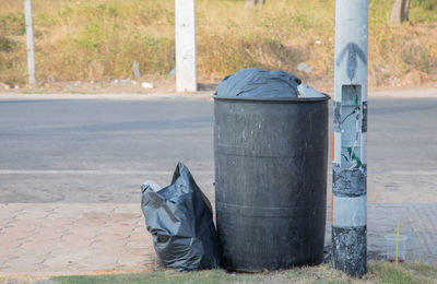 Garbage bin on street in city