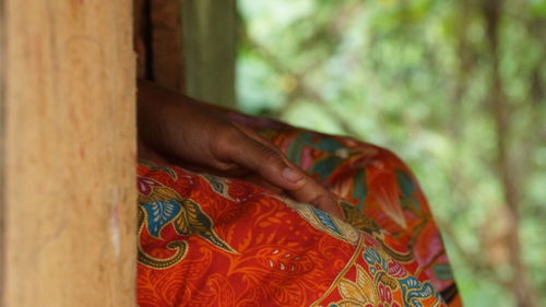 Close-up of woman hand against blurred background