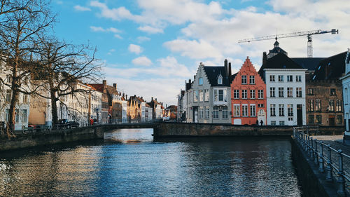 Canal amidst buildings in city