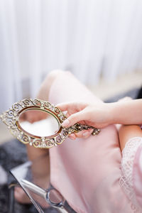 Close-up of woman holding hands