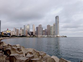 View of city against cloudy sky