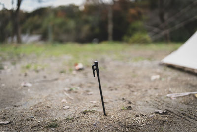 Close-up of empty chair on field