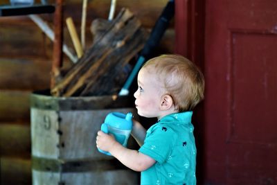 Side view of cute boy looking away
