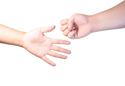 Close-up of hands over white background