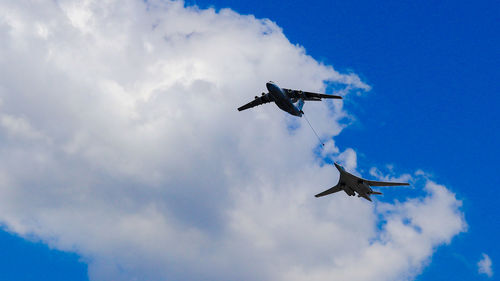 Low angle view of airplane flying in sky