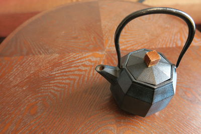 High angle view of teapot on table