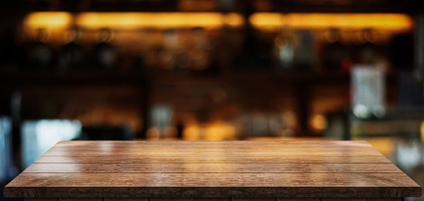 Close-up of empty wooden table in restaurant