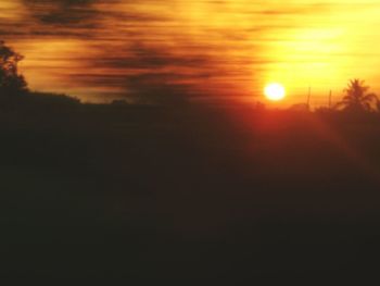 Scenic view of silhouette landscape against sky during sunset