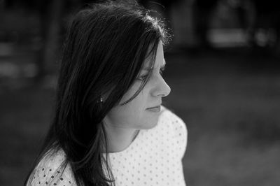 Close-up of young woman looking away