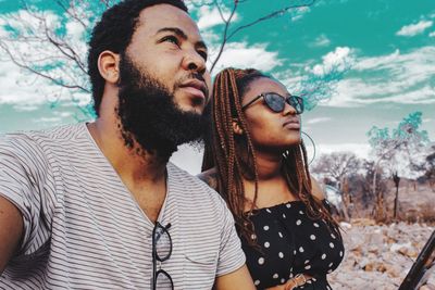 Portrait of young couple looking away