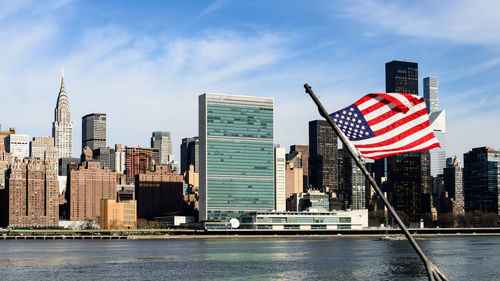 American flag against city skyline