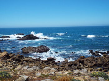 Scenic view of sea against clear sky