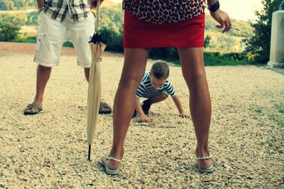 Boy with parents on field