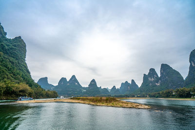 Scenic view of bay against sky