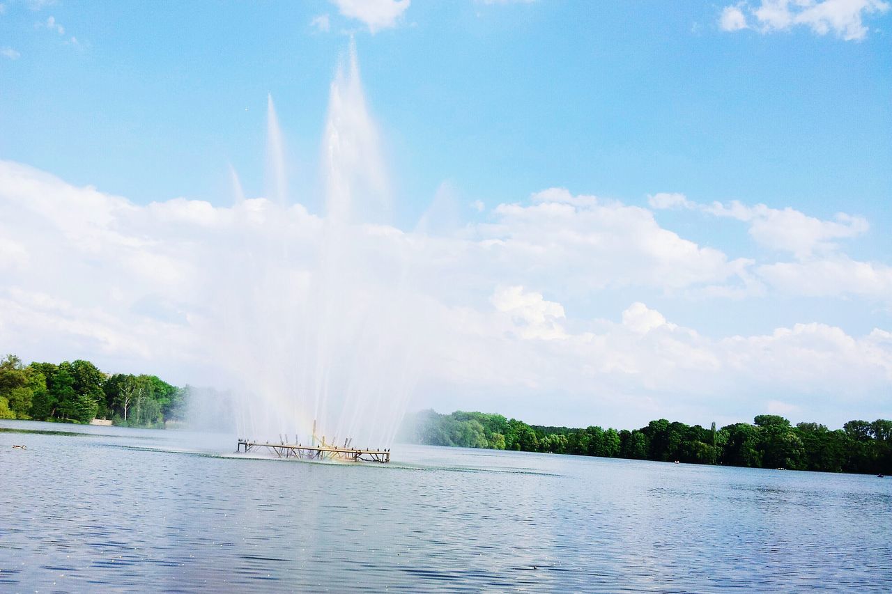 water, sky, waterfront, beauty in nature, scenics, motion, tree, cloud - sky, nature, tranquil scene, river, tranquility, sea, cloud, waterfall, day, idyllic, power in nature, outdoors, sunlight