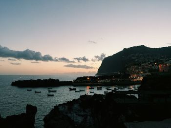 Scenic view of sea against clear sky during sunset