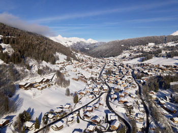 Scenic view of snow covered mountains against sky at les gets, ski resort in the french alps