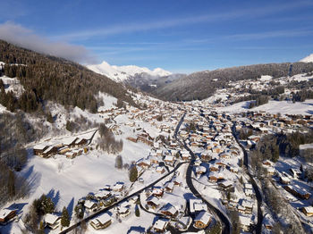 Scenic view of snow covered mountains against sky