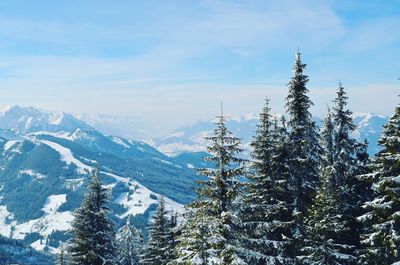 Scenic view of snow covered mountains against sky