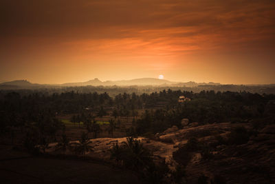 Scenic view of landscape against sky during sunset