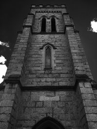 Low angle view of bell tower against sky