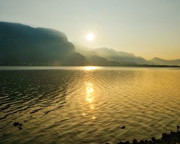 Scenic view of lake against sky during sunset