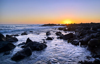 Scenic view of sea against sky during sunset