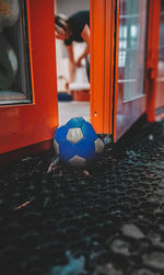 Close-up of soccer ball on window