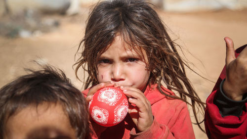 Portrait of young girl in a syrian refugee camp. 