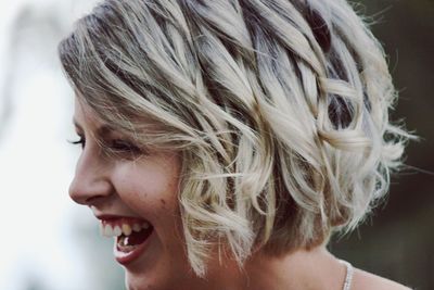 Close-up of smiling woman with short hair