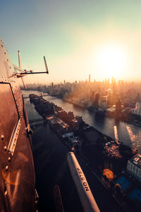 Aerial view of city buildings against sky during sunset new york city