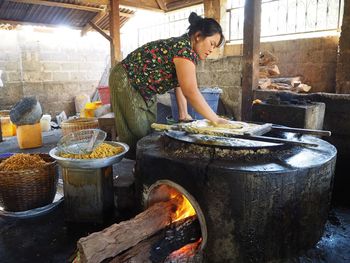 Woman working in kitchen