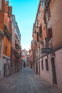 Narrow alley amidst buildings in town