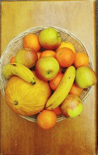 High angle view of fruits in basket on table