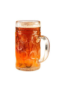 Close-up of beer glass against white background